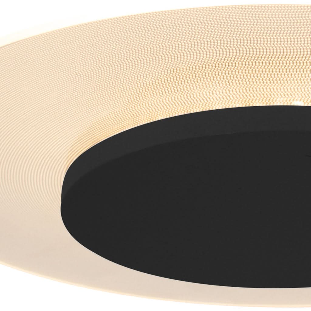 Vue en angle serrée montrant la jupe tissée beige et le boîtier noir