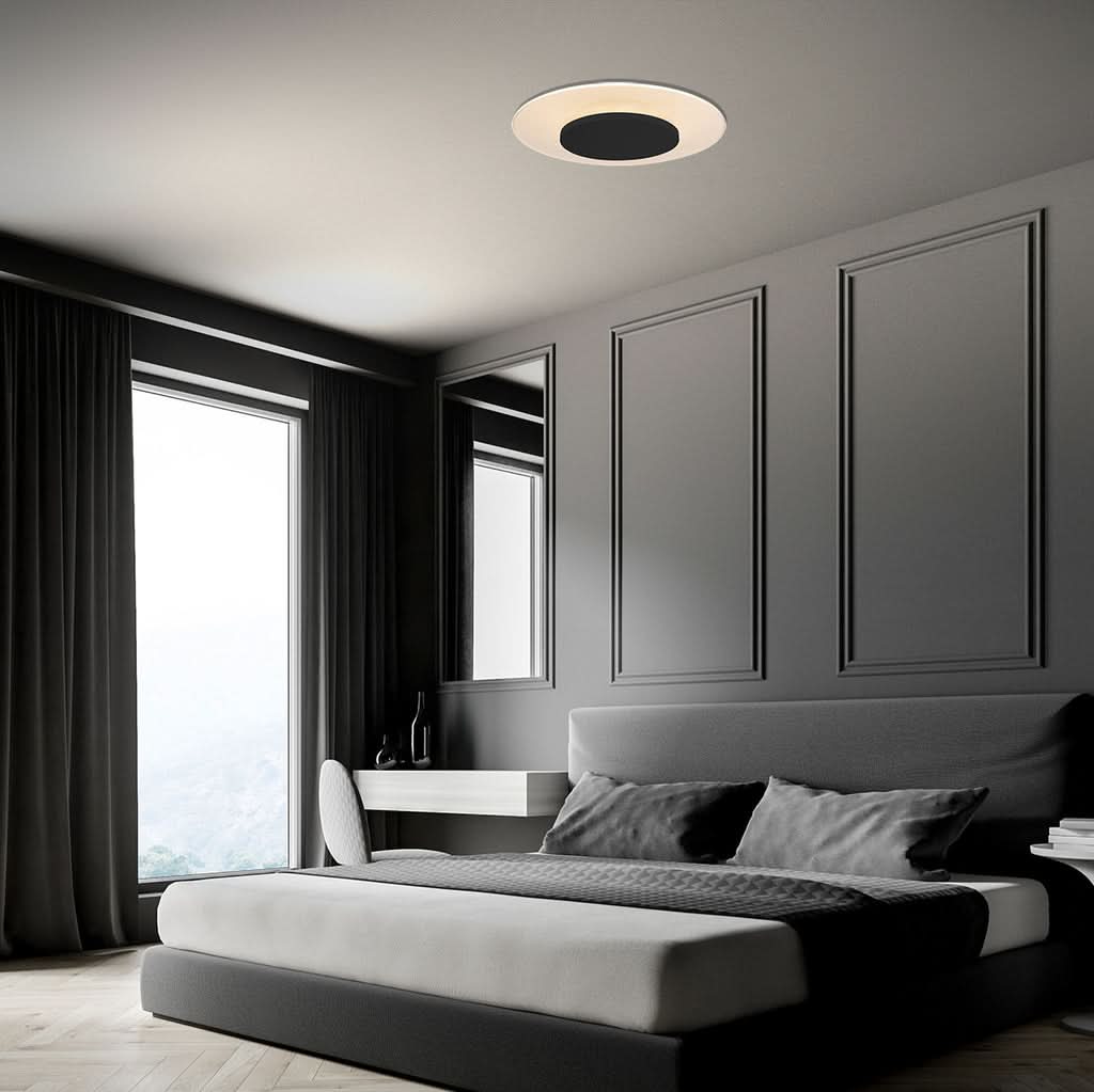Mise en ambiance d'une chambre avec plafonnier rond fixé au plafond.