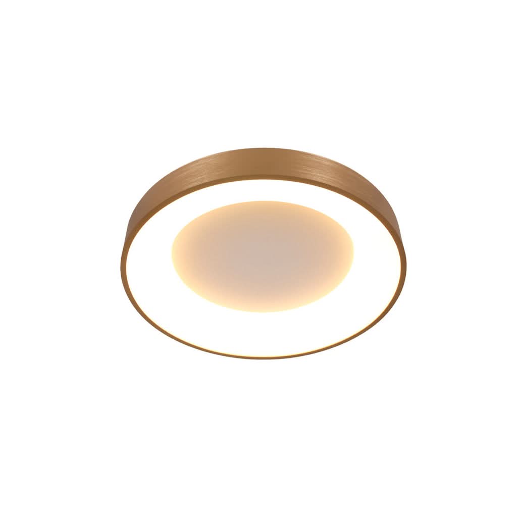 Vue de dessous du luminaire allumé, diffuseur blanc et halo lumineux central