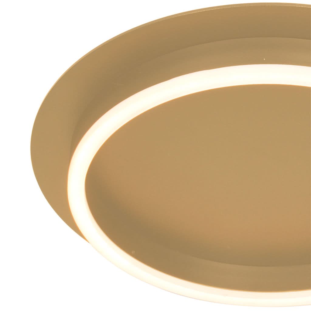 Gros plan sur l'anneau lumineux LED à lumière chaude du plafonnier doré