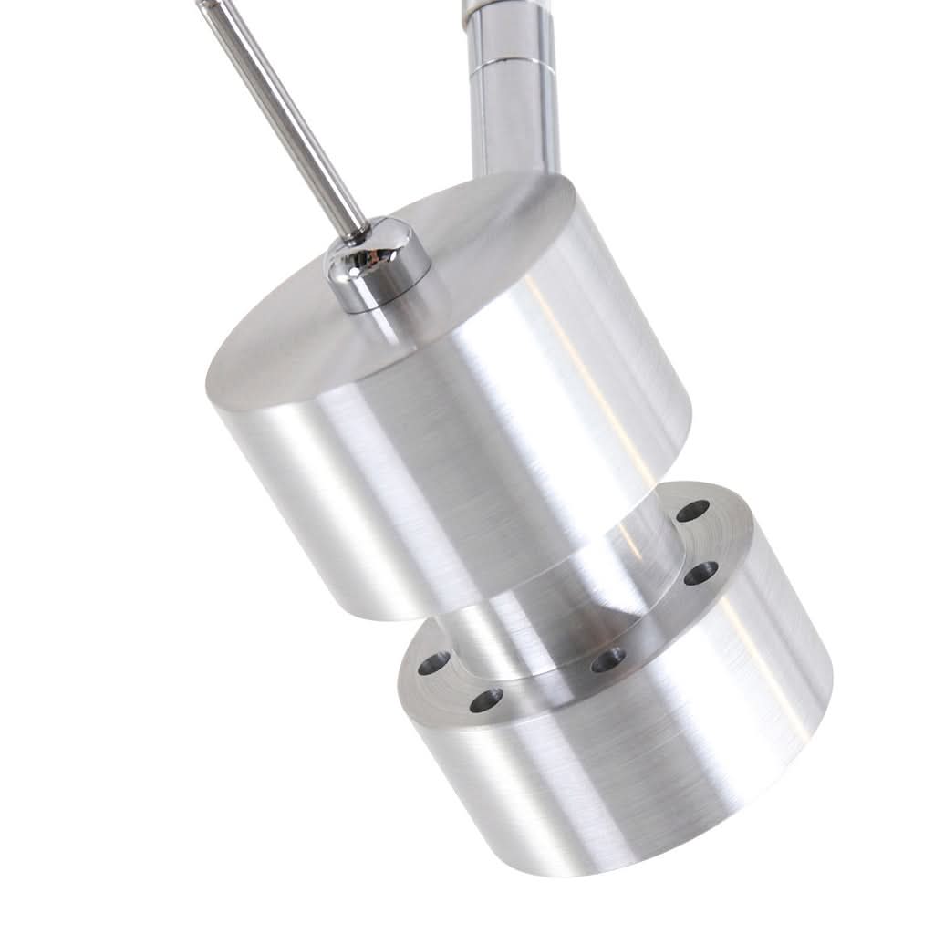 Gros plan sur un projecteur cylindrique orientable et son support métallique.
