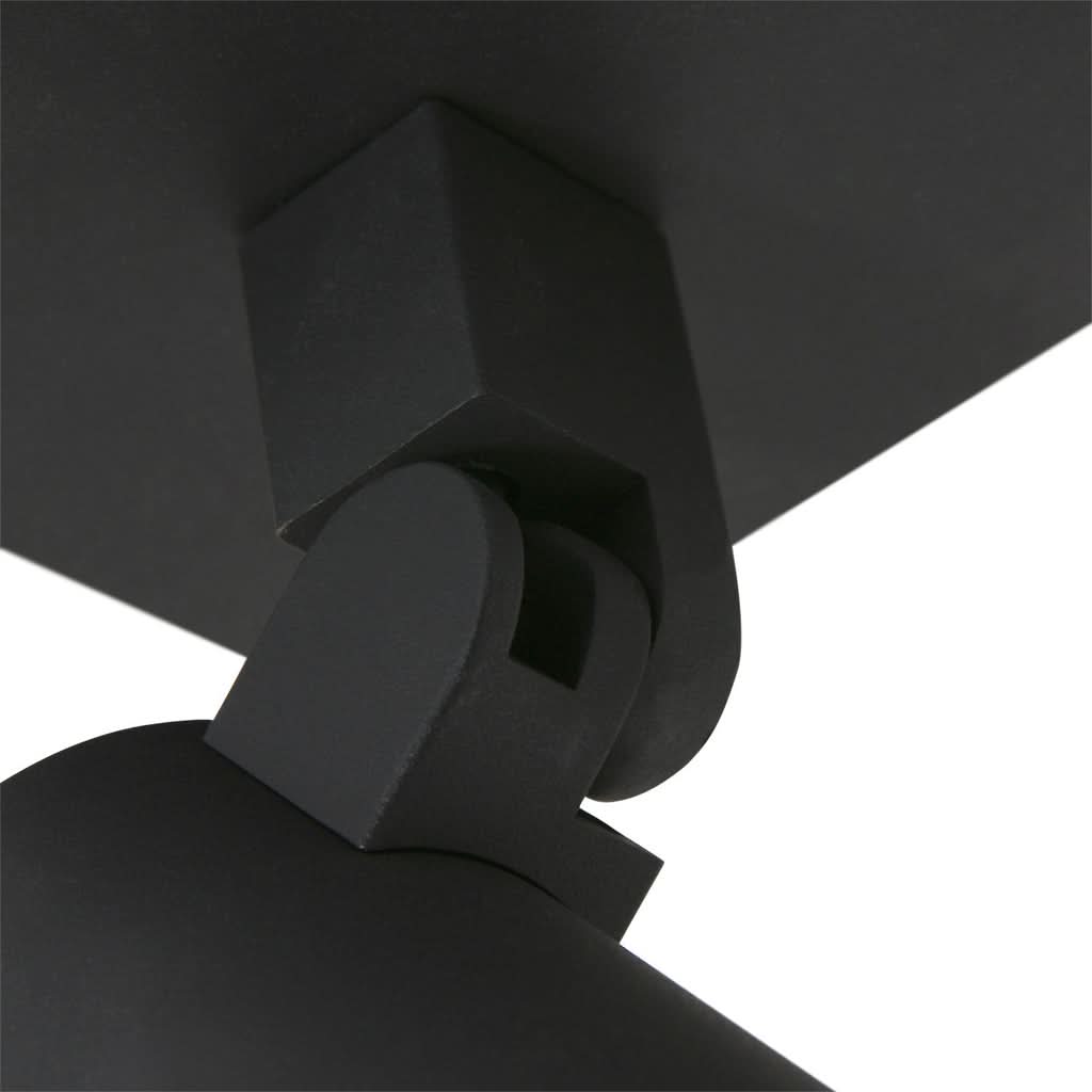 Gros plan sur l'articulation pivotante reliant le socle carré au projecteur
