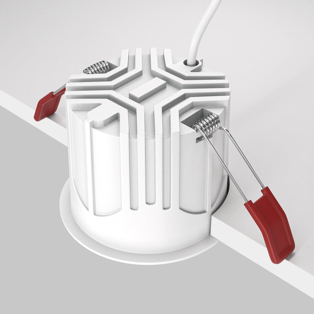 Vue arrière du spot : corps cylindrique, dissipateur strié et ressorts de fixation
