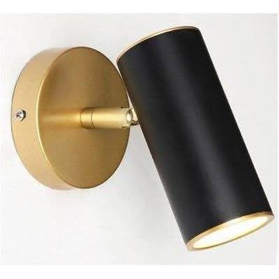 Détail du cylindre noir et de la base dorée avec bras articulé.