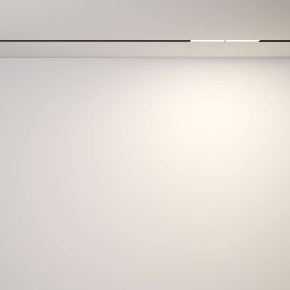 Mise en ambiance, halo de lumière douce projeté sur un mur blanc