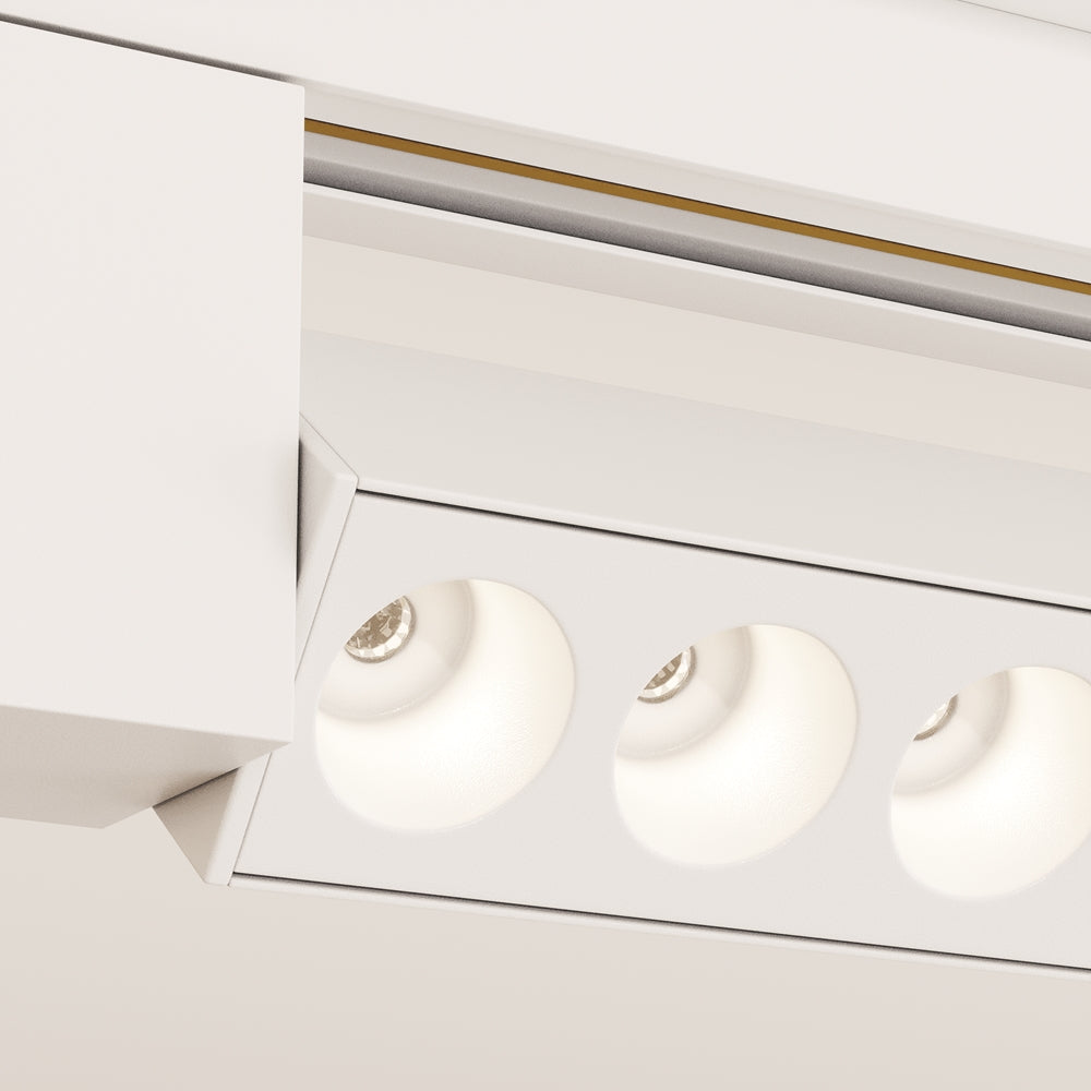 Détail rapproché des modules optiques blancs et de leur anneau lumineux allumé.