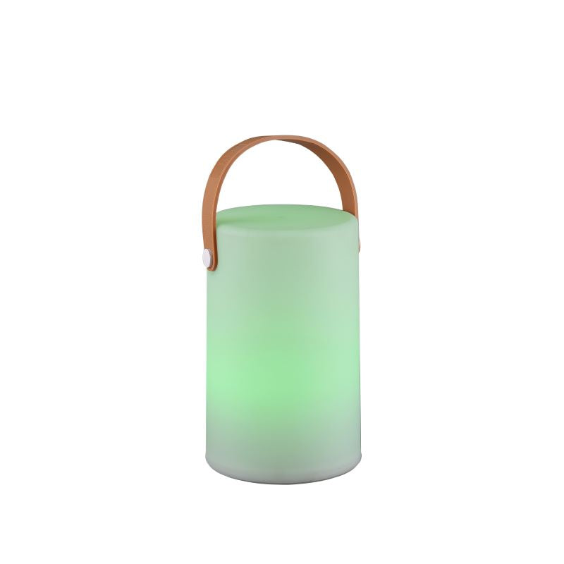 Lampe à poser blanche allumée en vert, éclat coloré sur le cylindre opaque.