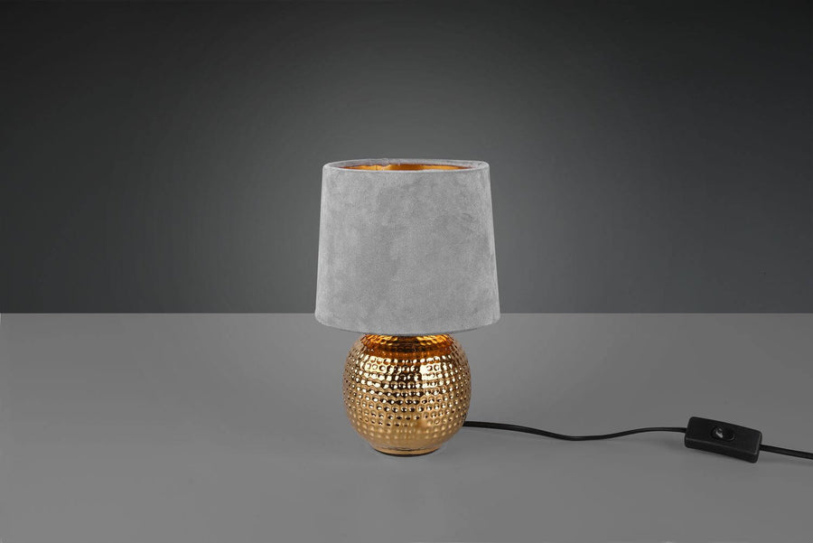 Lampe à poser isolée, cordon noir avec interrupteur et finition céramique dorée