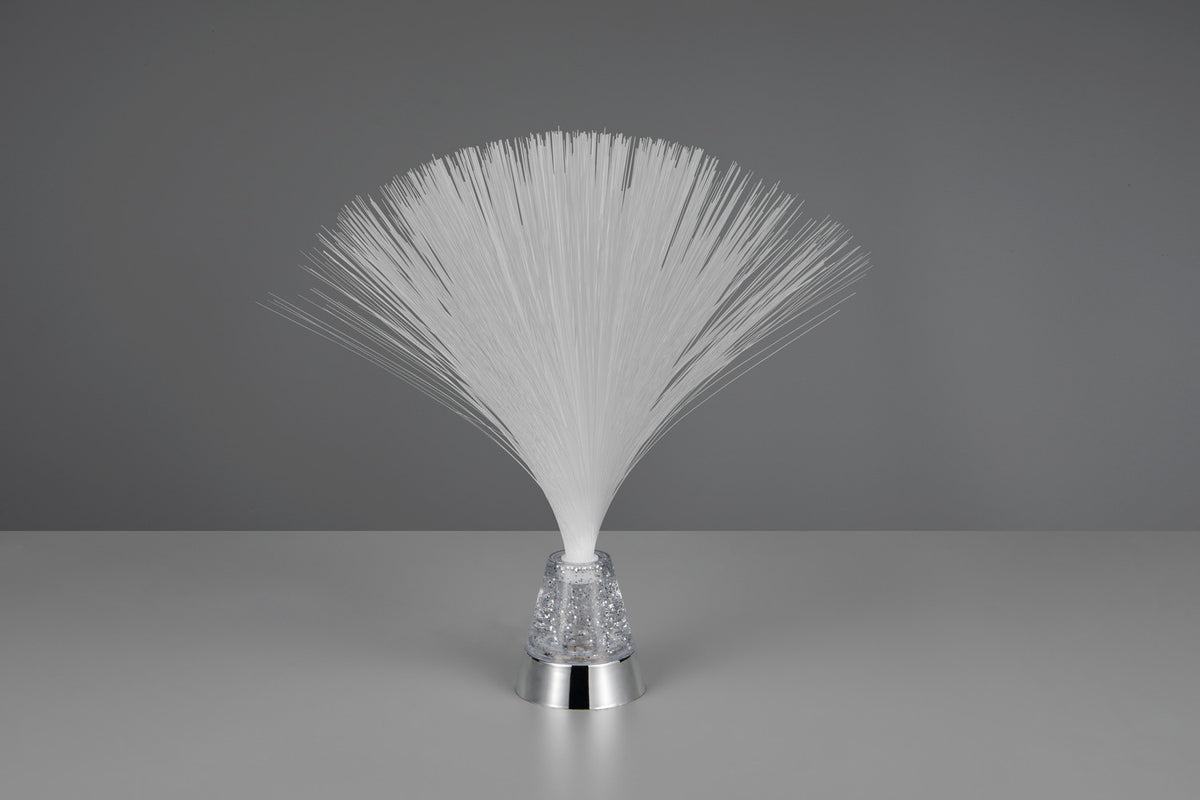 Sur fond gris, lampe éteinte avec base chromée et cône transparent scintillant.