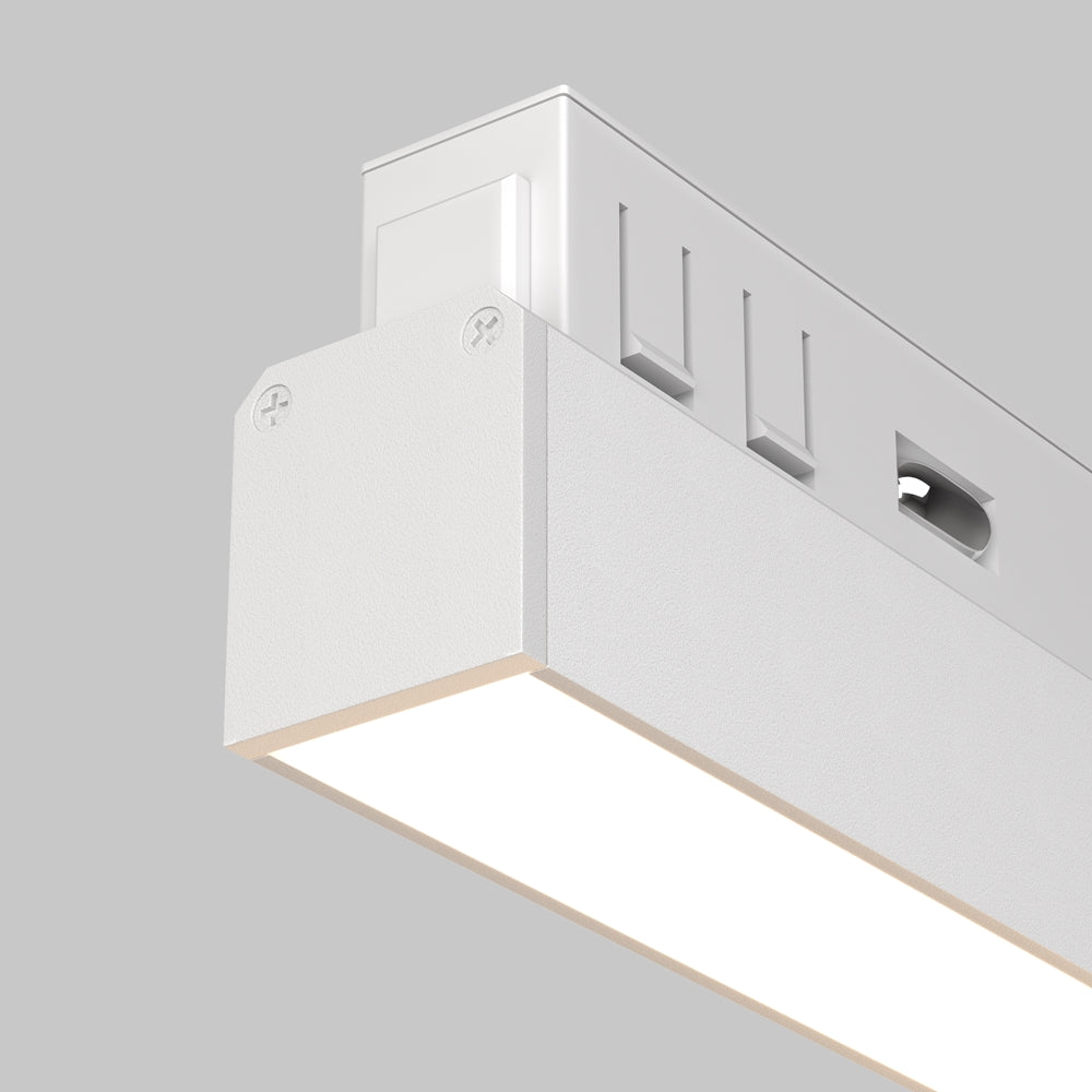 Gros plan sur le raccord d'angle en aluminium blanc et ses vis