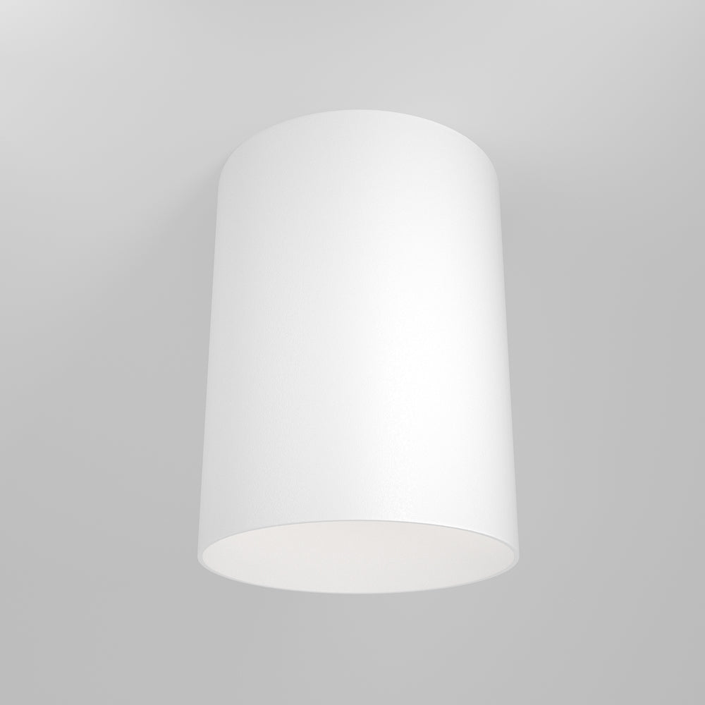 Plafonnier cylindrique blanc fixé au plafond, face avant sur fond gris clair