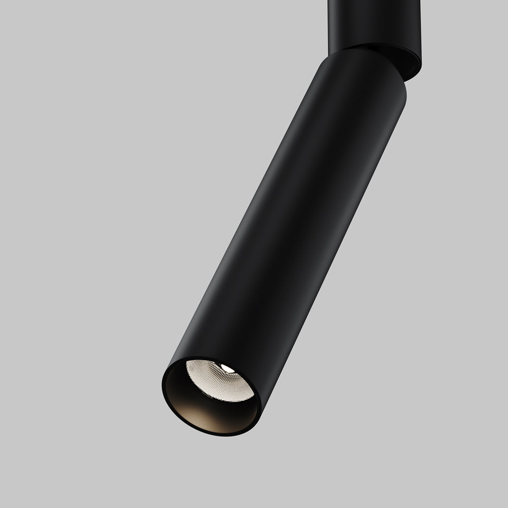 Détail rapproché de la tête cylindrique noire mate et de sa lentille diffuseuse.