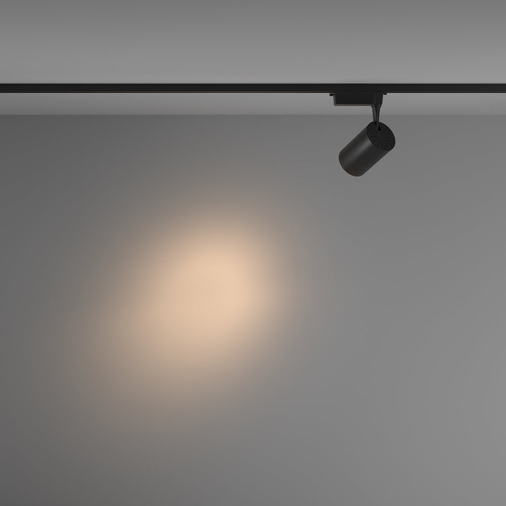 Mise en ambiance d'un halo de lumière chaude sur une cloison grise