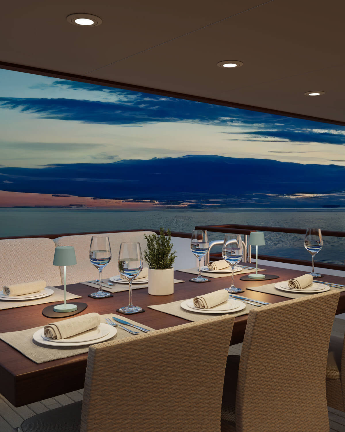 Deux lampes vertes posées sur une table dressée face à la mer