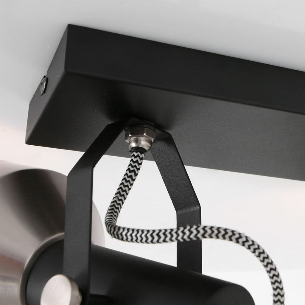 Vue rapprochée de la platine de plafond et du câble textile tressé