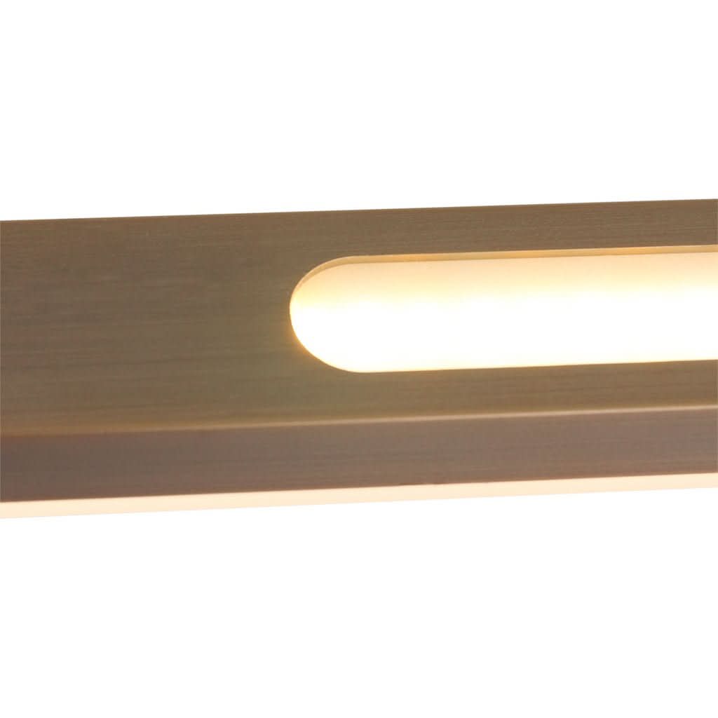 Détail de la fente lumineuse ovale diffusant une lumière chaude sous le profil