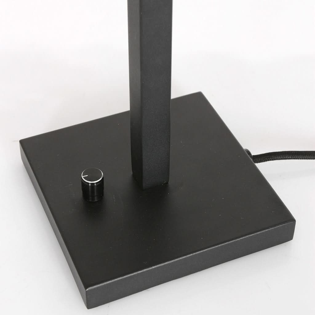 Détail du socle carré noir avec variateur rotatif et câble électrique tressé.
