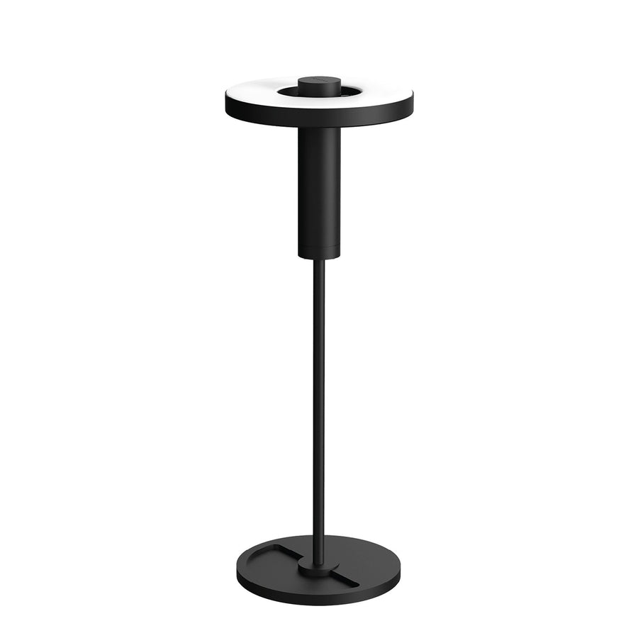 Vue de trois quarts de la lampe, tête annulaire horizontale et socle rond