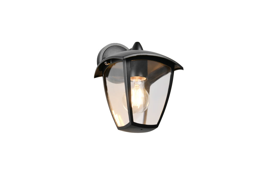 Vue rapprochée de l'applique extérieure noire, ampoule Edison allumée sous verre bombé.
