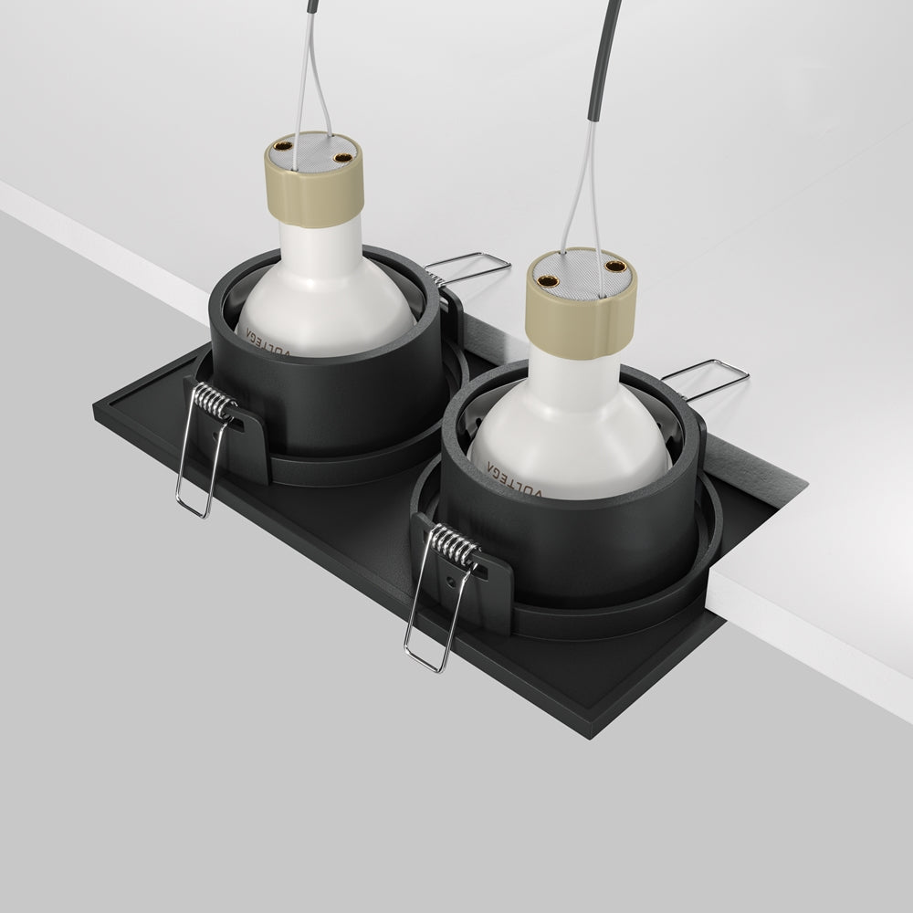 Vue arrière du luminaire montrant ampoules, ressorts de fixation et découpe du plafond