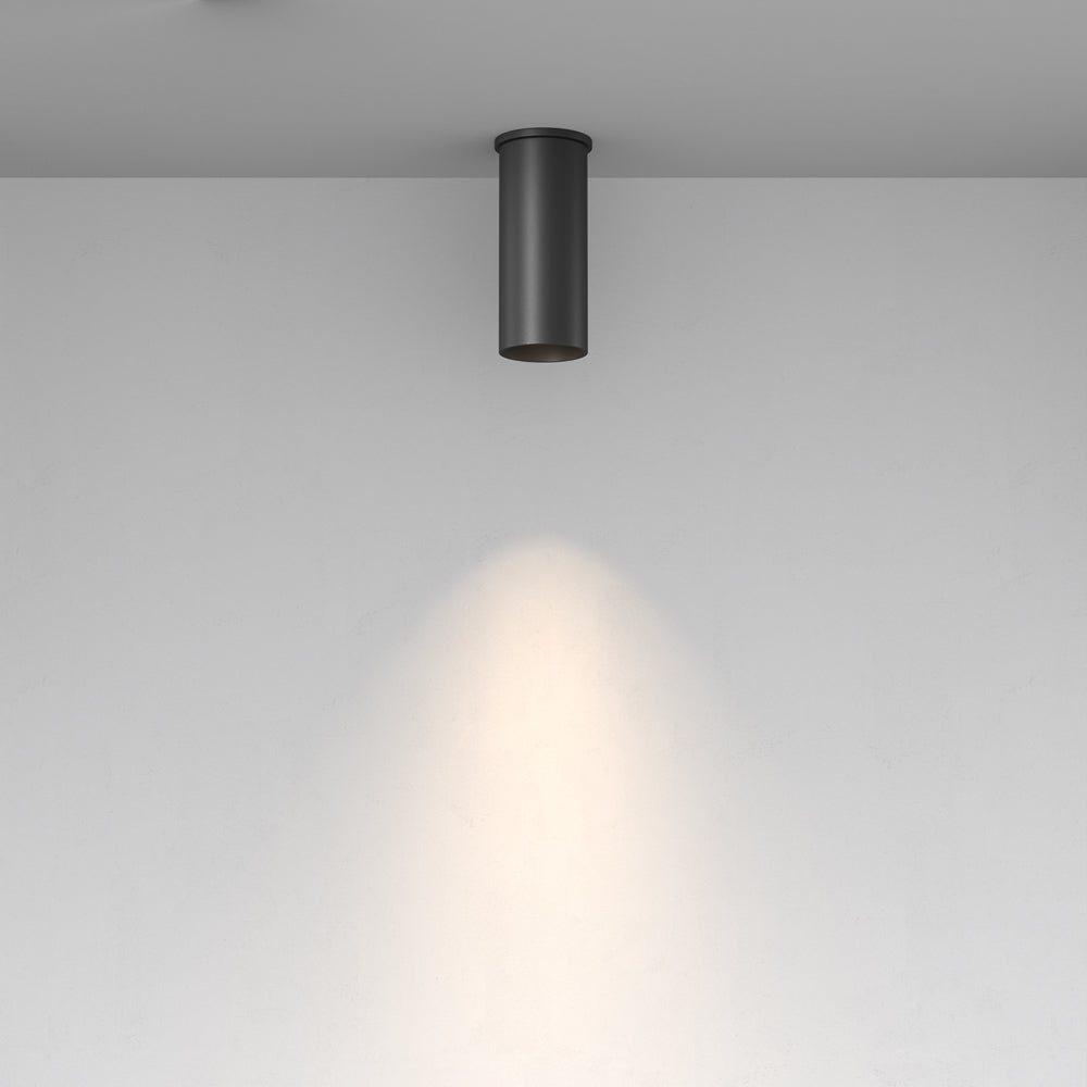 Mise en ambiance : faisceau lumineux rond projeté sur un mur blanc