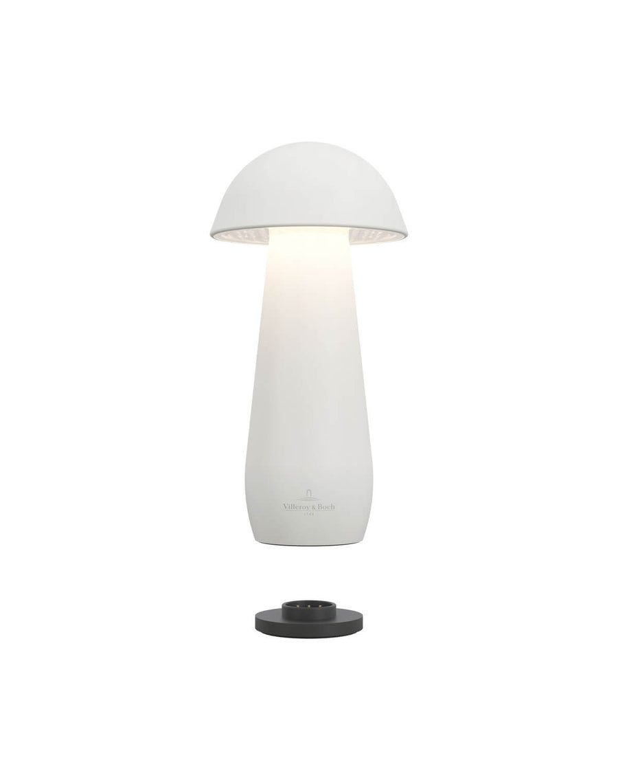 Vue éclatée : lampe blanche au-dessus de sa base de recharge noire