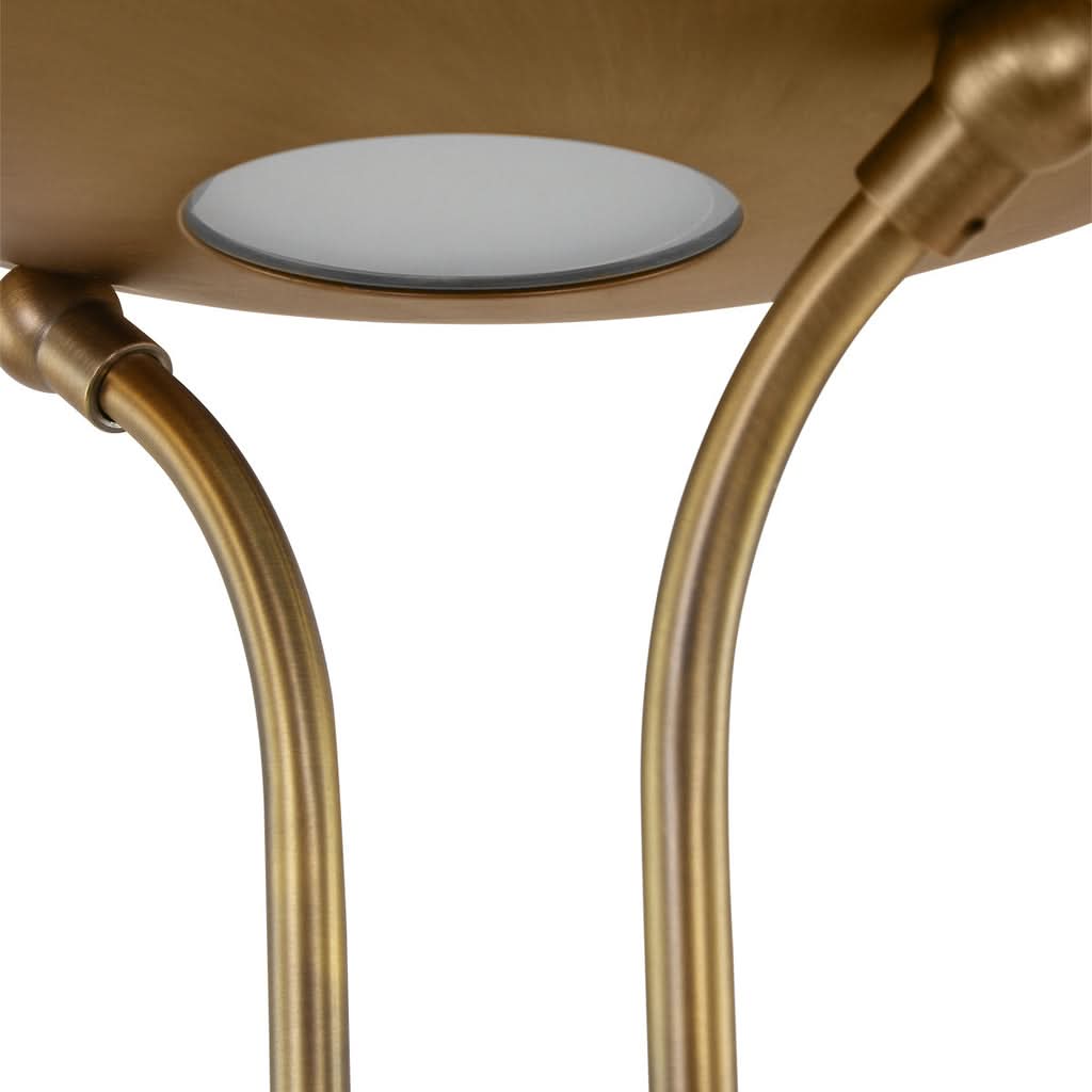Détail du diffuseur supérieur en verre et des deux tiges courbées fixées à la coupole.