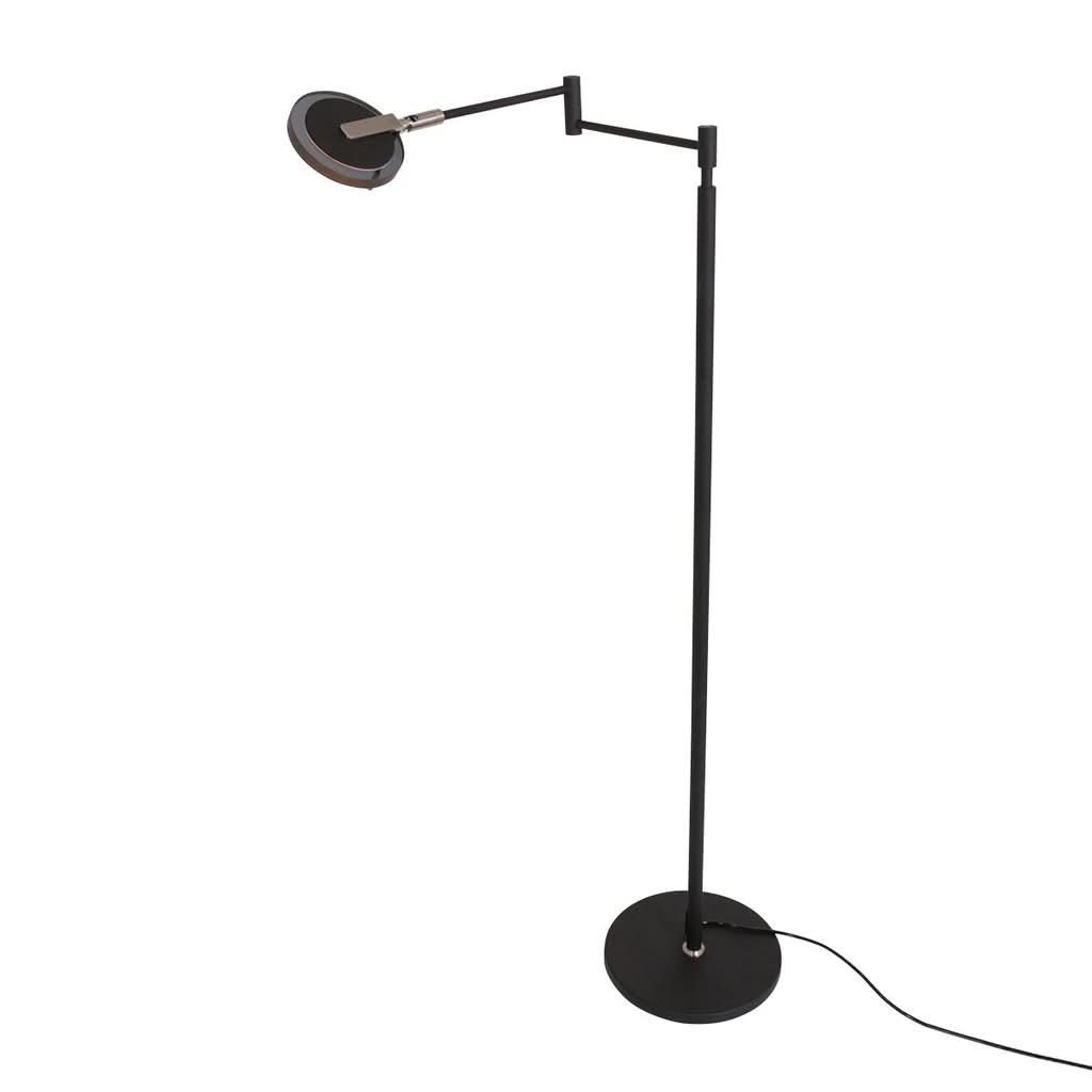 Lampe sur pied avec câble apparent, base ronde et bras déployé, vue de trois quarts.