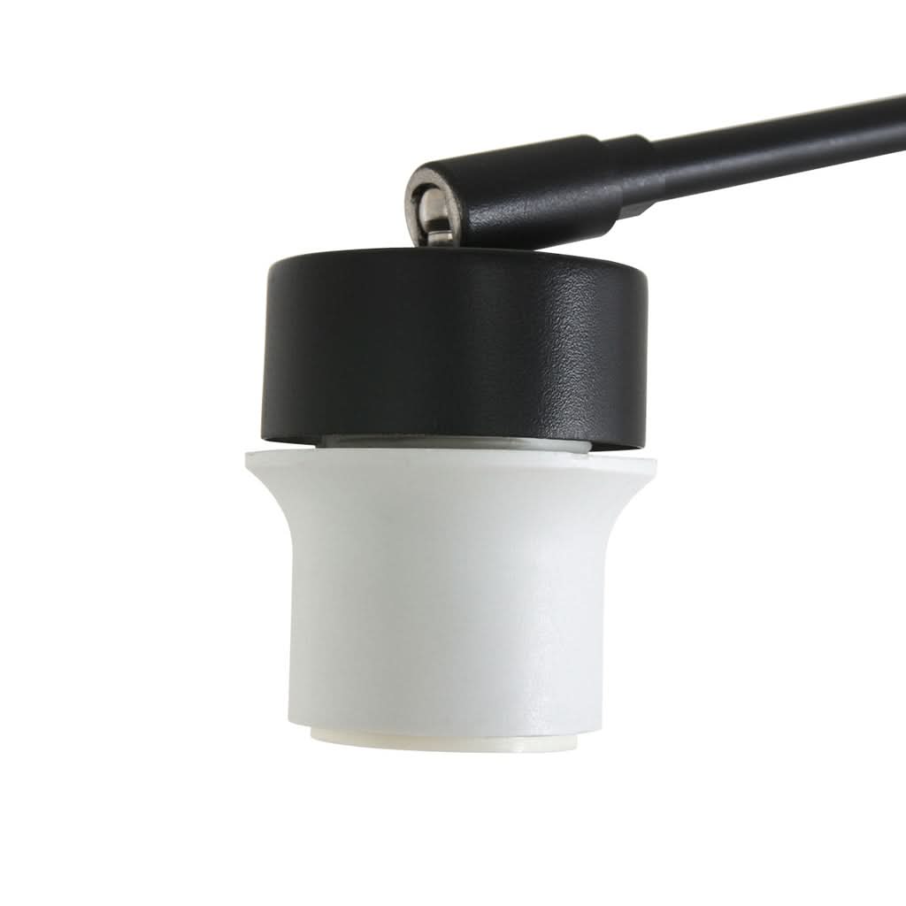 Gros plan sur le diffuseur cylindrique blanc et la partie supérieure noire.