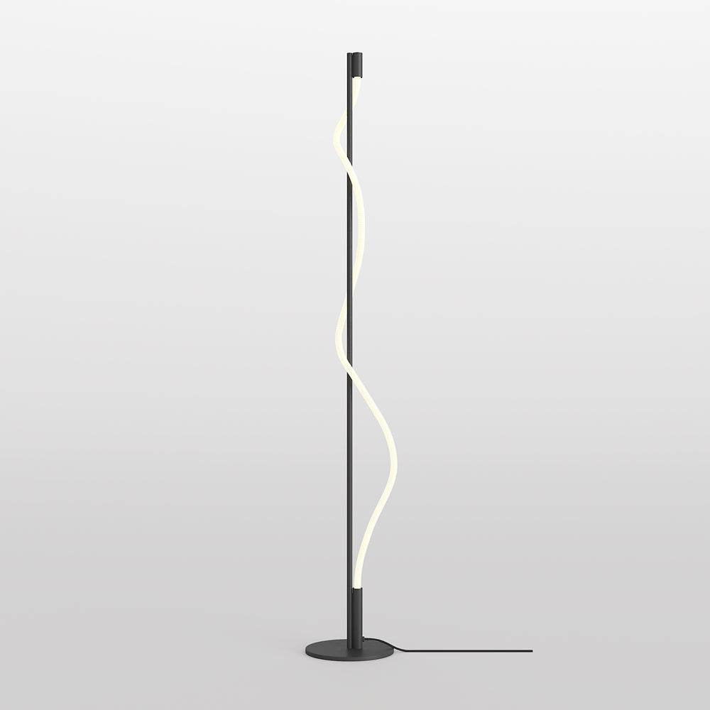 Lampadaire noir avec tube LED ondulant, socle rond et câble d'alimentation au sol.