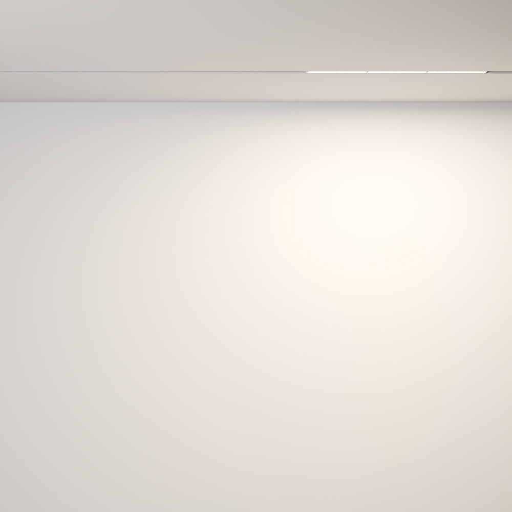 Mise en ambiance d'un mur éclairé par le halo diffus du luminaire encastré