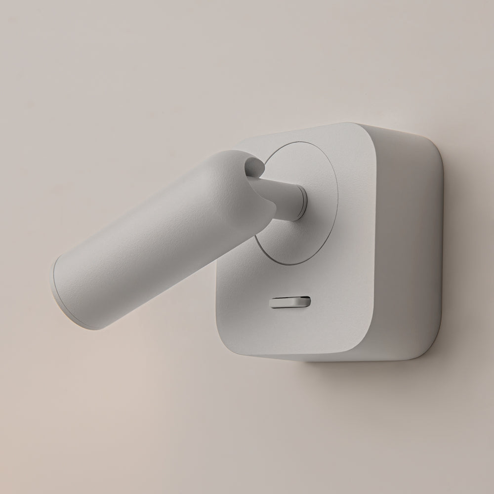 Gros plan sur l'articulation pivotante reliant le cylindre à la platine murale