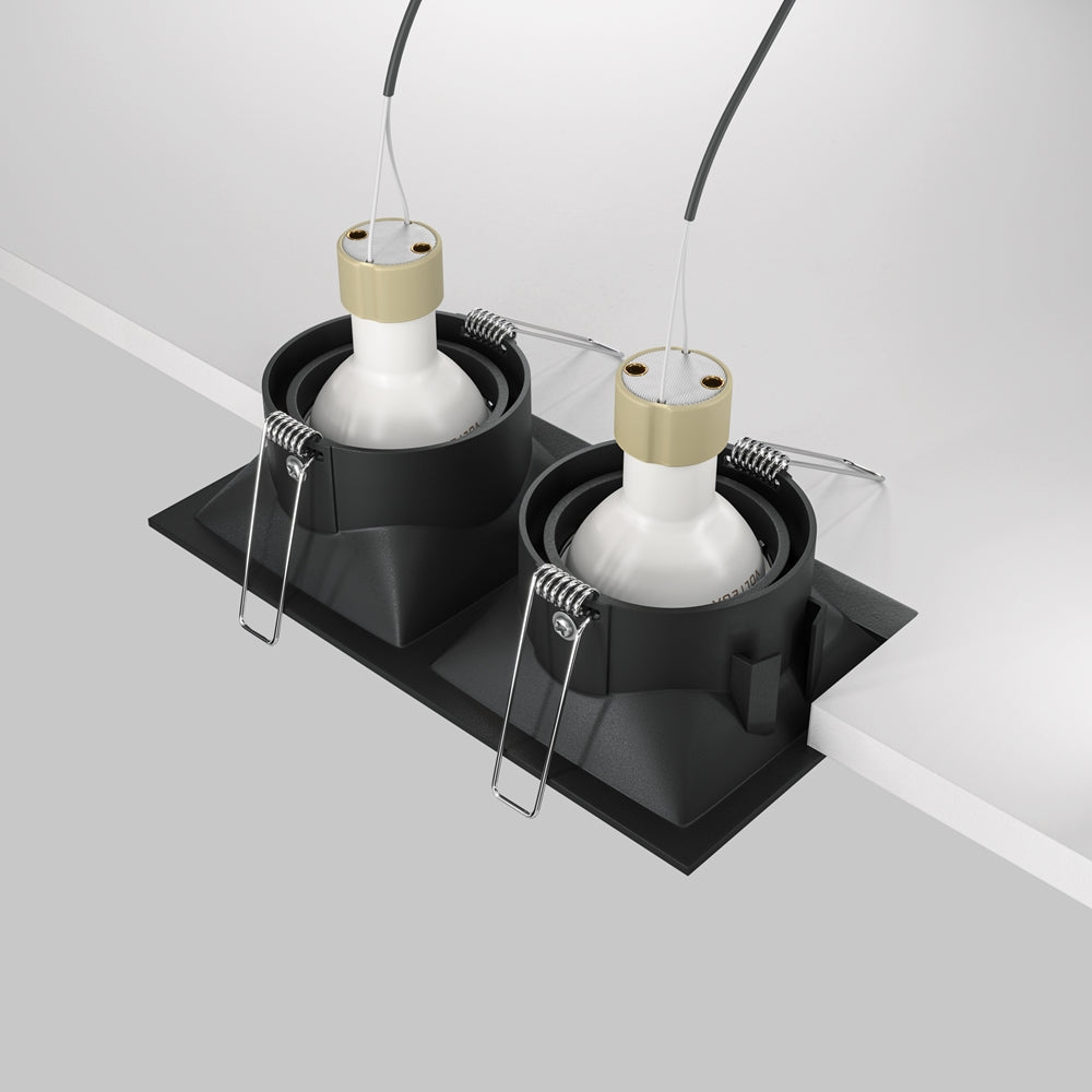 Vue arrière du luminaire montrant ressorts de fixation et modules d'éclairage.