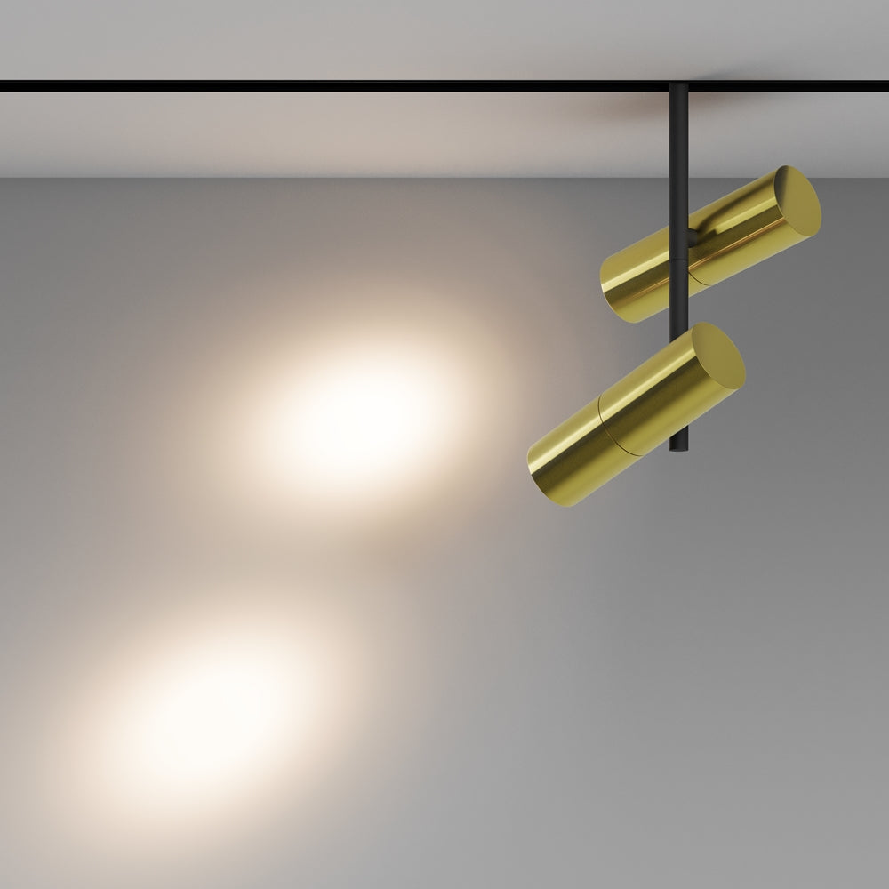 Mise en ambiance montrant deux halos lumineux projetés sur un mur gris