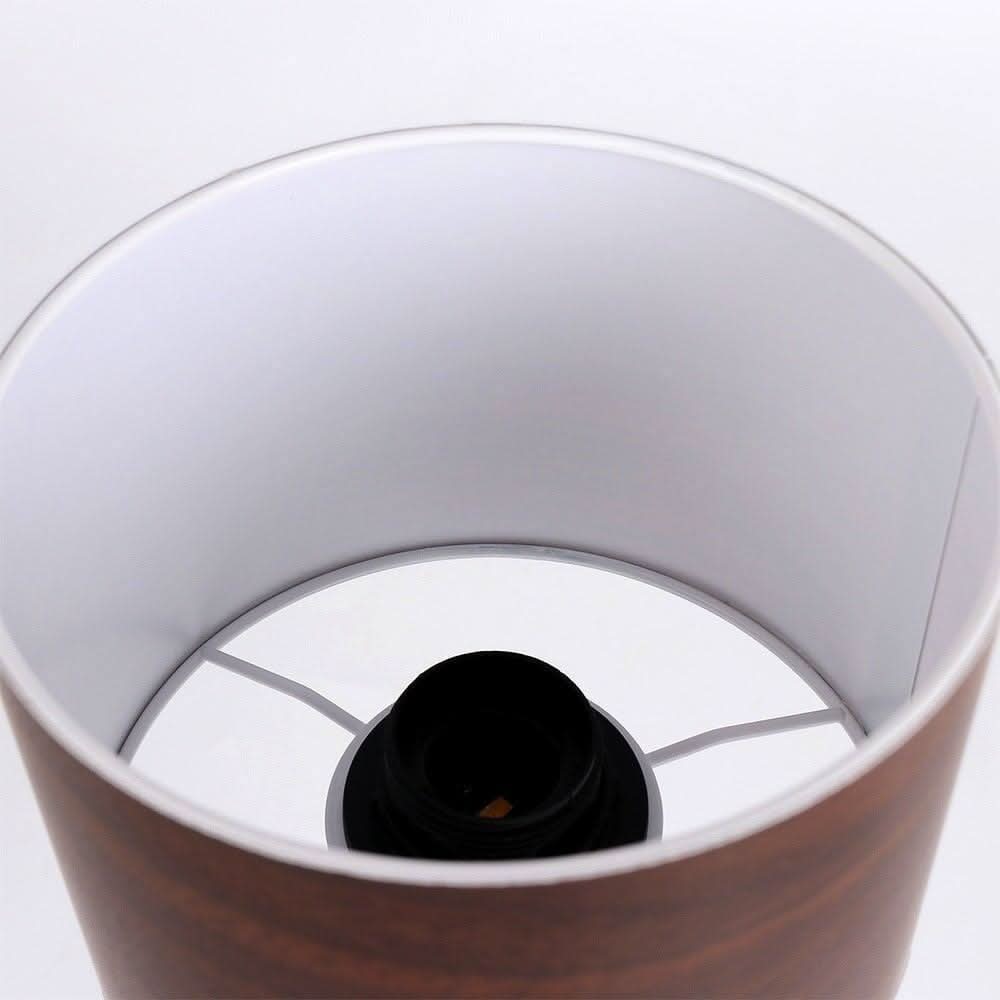 Intérieur de l'abat-jour cylindrique montrant la douille et le diffuseur blanc