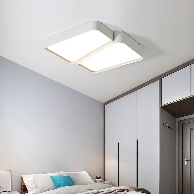 Plafonnier double rectangle installé au plafond d'une chambre à coucher moderne